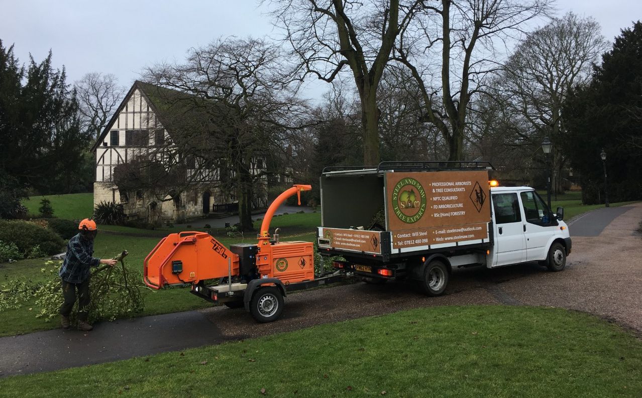 Shredding tree clippings in the museum gardens