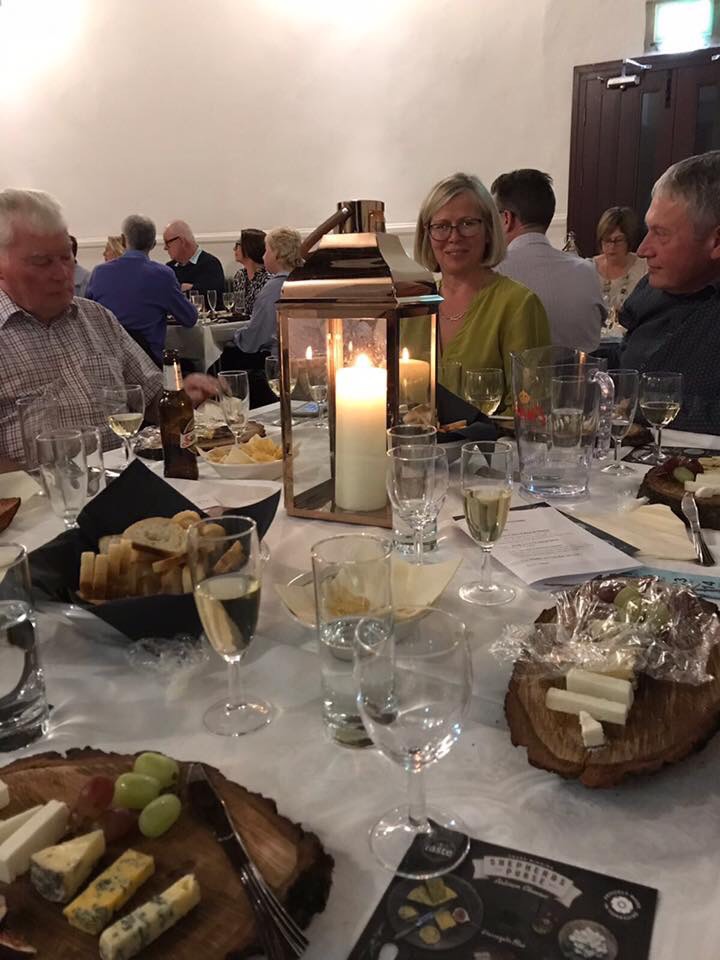wooden cheeseboards in use at a charity event