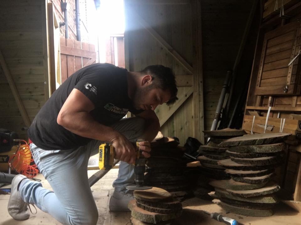 making cheesboards from logs for a charity event